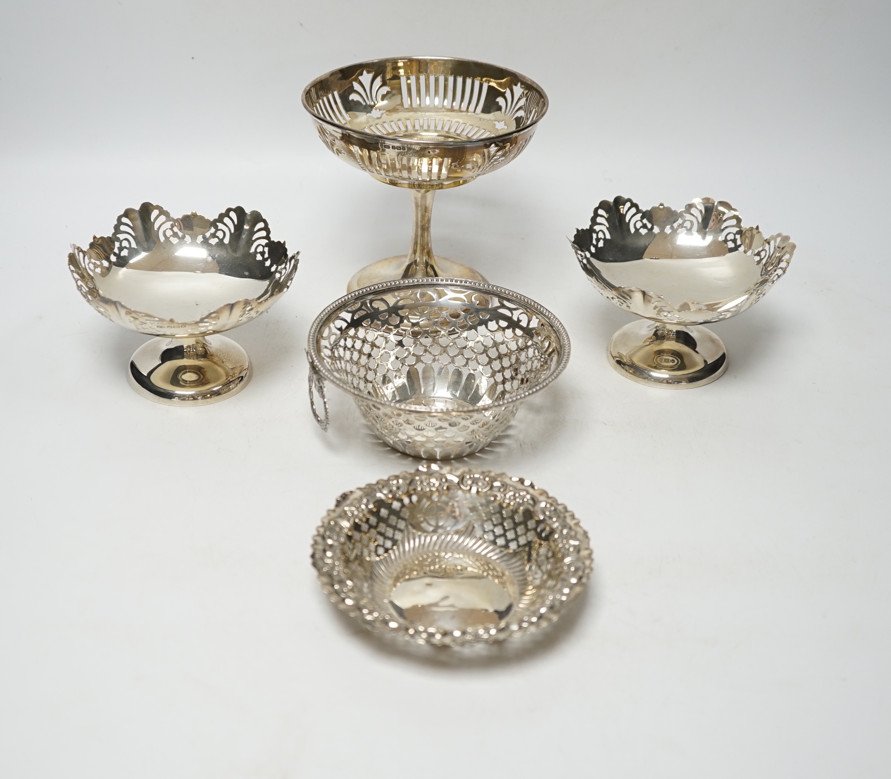 A pair of George VI pierced silver pedestal bon bon dishes, Viners Ltd, Sheffield, 1947, 11.7cm and three other assorted silver bonbon dishes, one with ring handles.